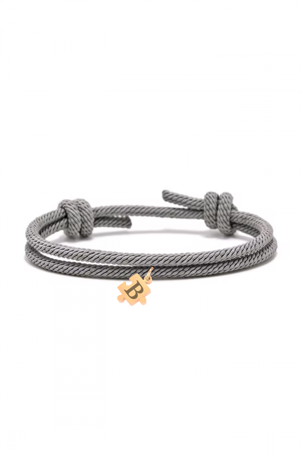 Pulsera-cuerda-gris-puzzle-dorado